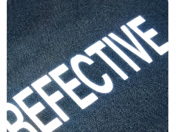 Reflective branding on activewear, applied in-house at the Eliian factory