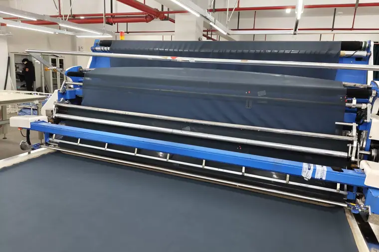 Fabric spreading table — Eliian activewear factory, Xiamen